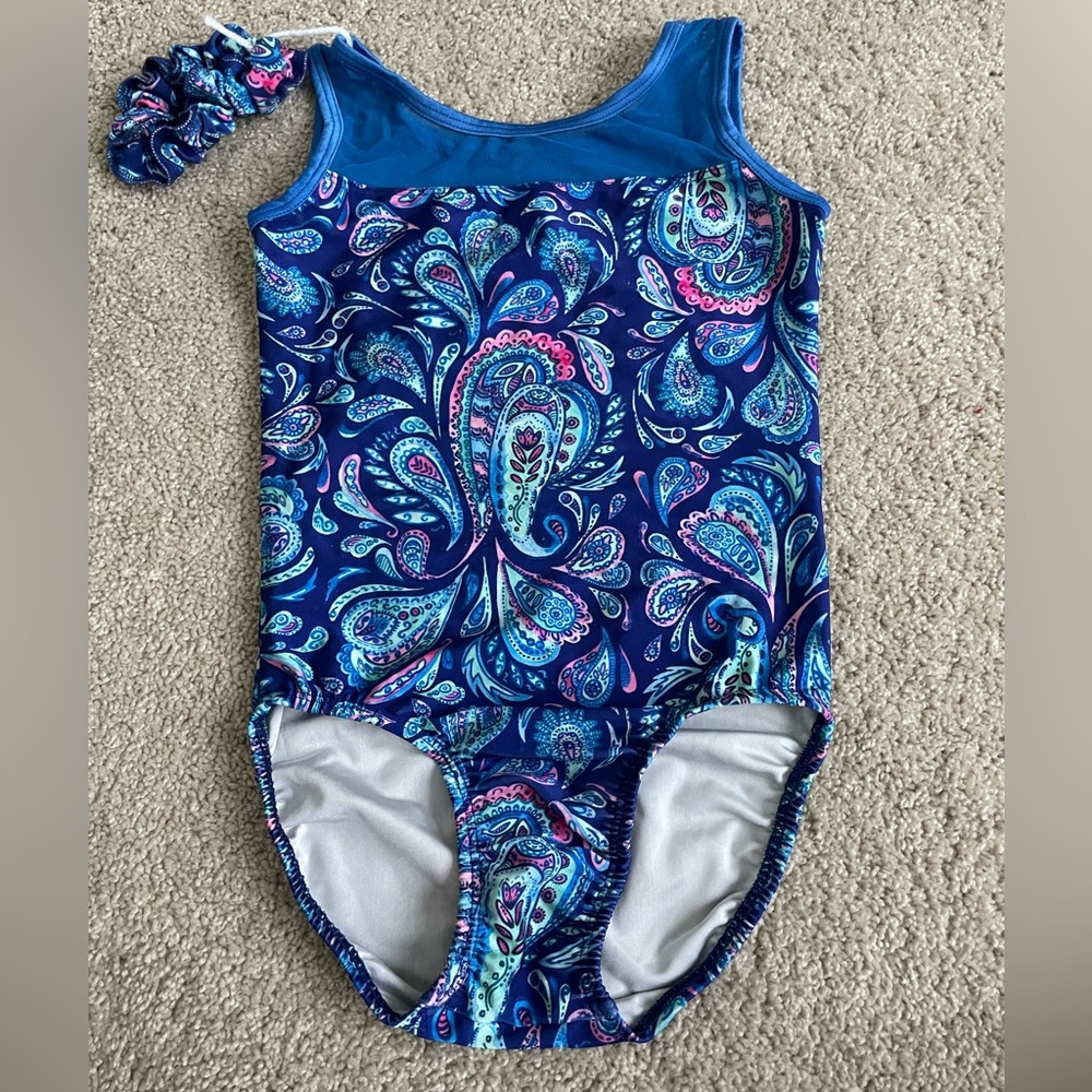 Gently used Plum Practicewear leotard in size child large with scrunchie